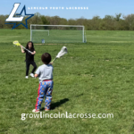 Micro lacrosse players practicing passing